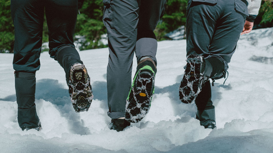 Someone running through snow wearing crampons